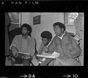 Ricardo Millett (left), graduate student who led seizure, sits in Ford Hall with Robert Jones and Roy DeBerry during protest at Brandeis University