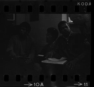 Ricardo Millett (left), graduate student who led seizure, sits in Ford Hall with Robert Jones and Roy DeBerry during protest at Brandeis University
