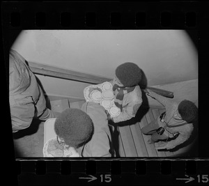 Black students at Brandeis University ascending stairs with trays of food during Ford Hall occupation