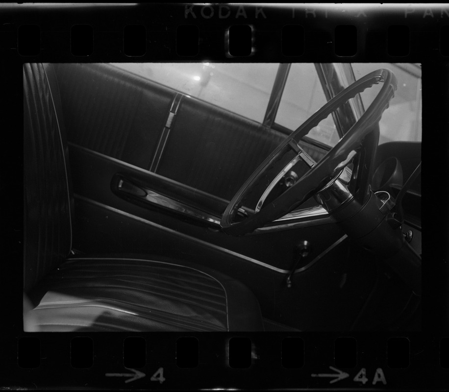 Driver seat and steering wheel inside a car