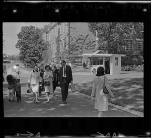 Group walking on campus before Brandeis University commencement