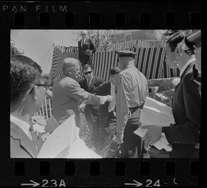 Screaming, Stephen Golin, 26 of Leach Lane, Natick, a graduate student and Ph.D candidate is dragged from Brandeis University Campus by Det. Arthur McGonigle of the Waltham Police and another detective after Golin refused to stop passing out anti-Vietnam war literature at the commencement exercises