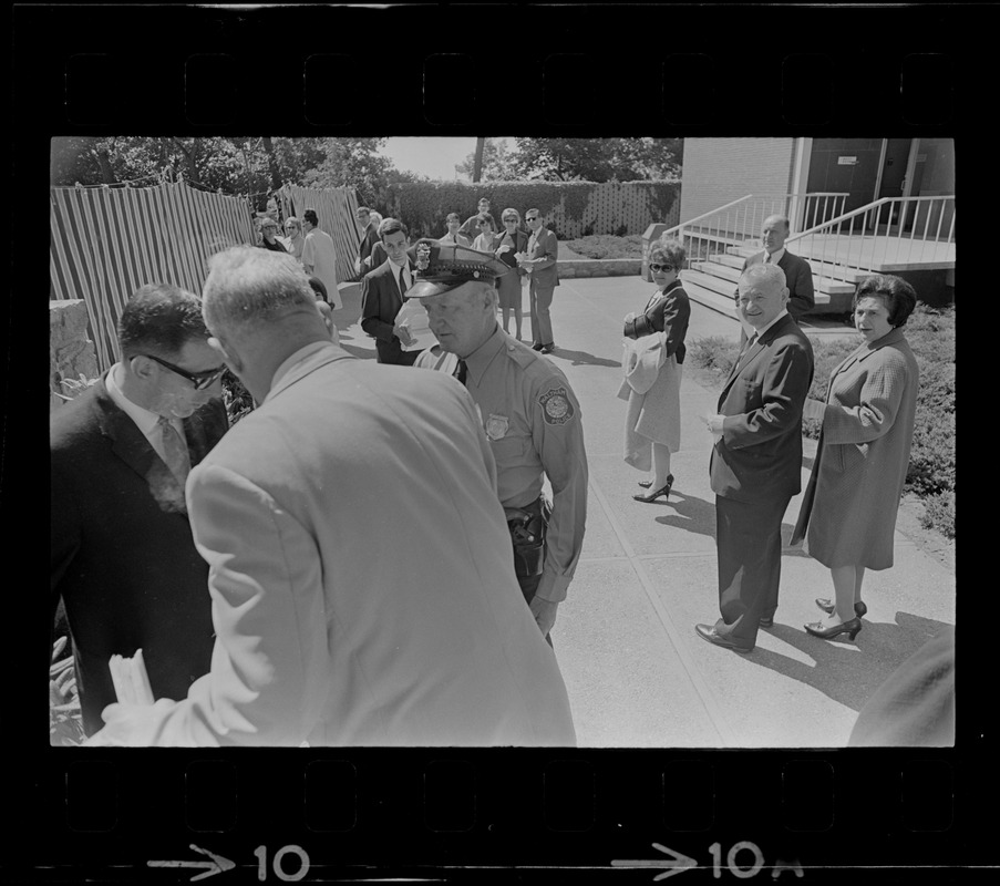 Screaming, Stephen Golin, 26 of Leach Lane, Natick, a graduate student and Ph.D candidate is dragged from Brandeis University Campus by Det. Arthur McGonigle of the Waltham Police and another detective after Golin refused to stop passing out anti-Vietnam war literature at the commencement exercises