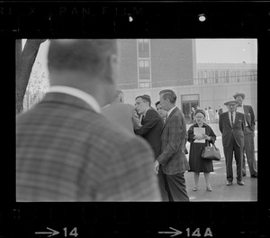 Stephen Golin, 26 of Leach Lane, Natick, a graduate student and Ph.D candidate surrounded by men during Brandeis University commencement