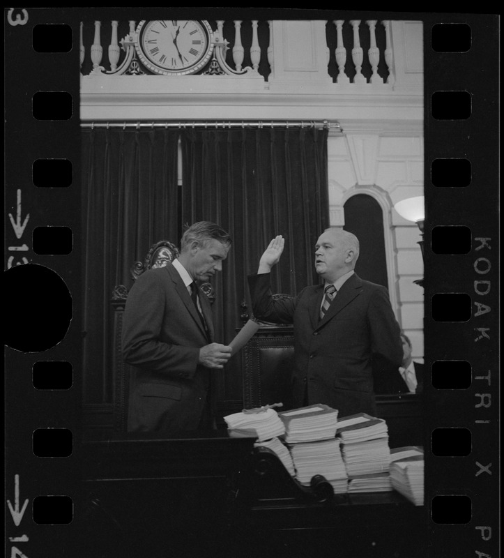 Judge Edward F. Hennessey takes oath of higher level of office from Governor Francis Sargent at the Senate Chambers in the State House