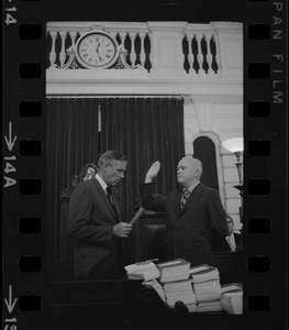 Judge Edward F. Hennessey takes oath of higher level of office from Governor Francis Sargent at the Senate Chambers in the State House