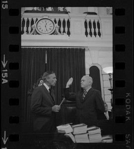 Judge Edward F. Hennessey takes oath of higher level of office from Governor Francis Sargent at the Senate Chambers in the State House