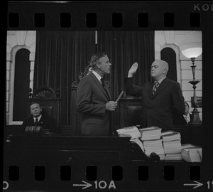Judge Edward F. Hennessey takes oath of higher level of office from Governor Francis Sargent at the Senate Chambers in the State House