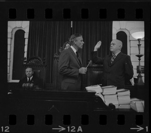 Judge Edward F. Hennessey takes oath of higher level of office from Governor Francis Sargent at the Senate Chambers in the State House