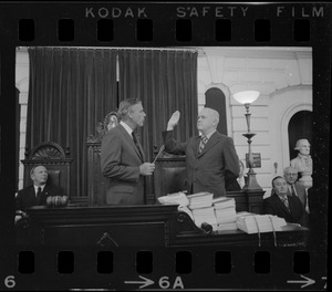 Judge Edward F. Hennessey takes oath of higher level of office from Governor Francis Sargent at the Senate Chambers in the State House