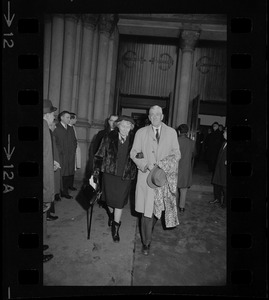 Senator Leverett Saltonstall and wife Alice entering Trinity Church Copley Square for former governor Christian A. Herter's memorial service
