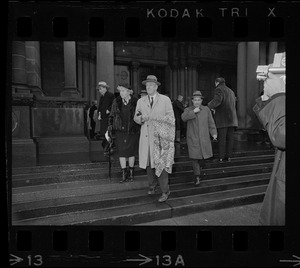 Senator Leverett Saltonstall and his wife Alice leaving Trinity Church Copley Square after the memorial service for former governor Christian A. Herter