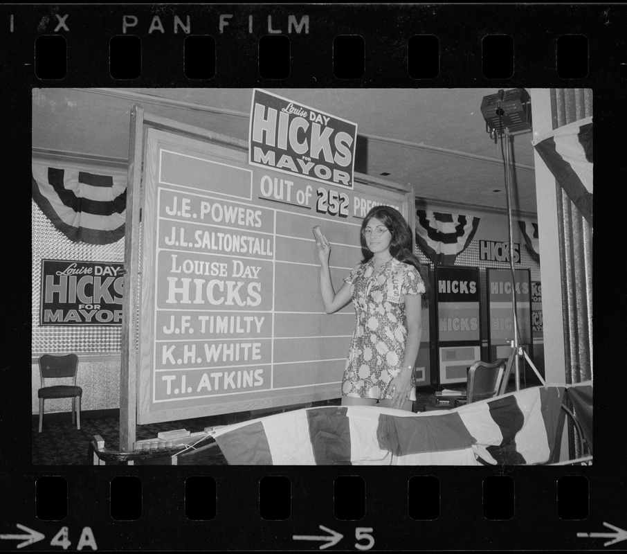 Campaign worker for Louise Day Hicks's primary race for mayor seen standing in front of vote counting board