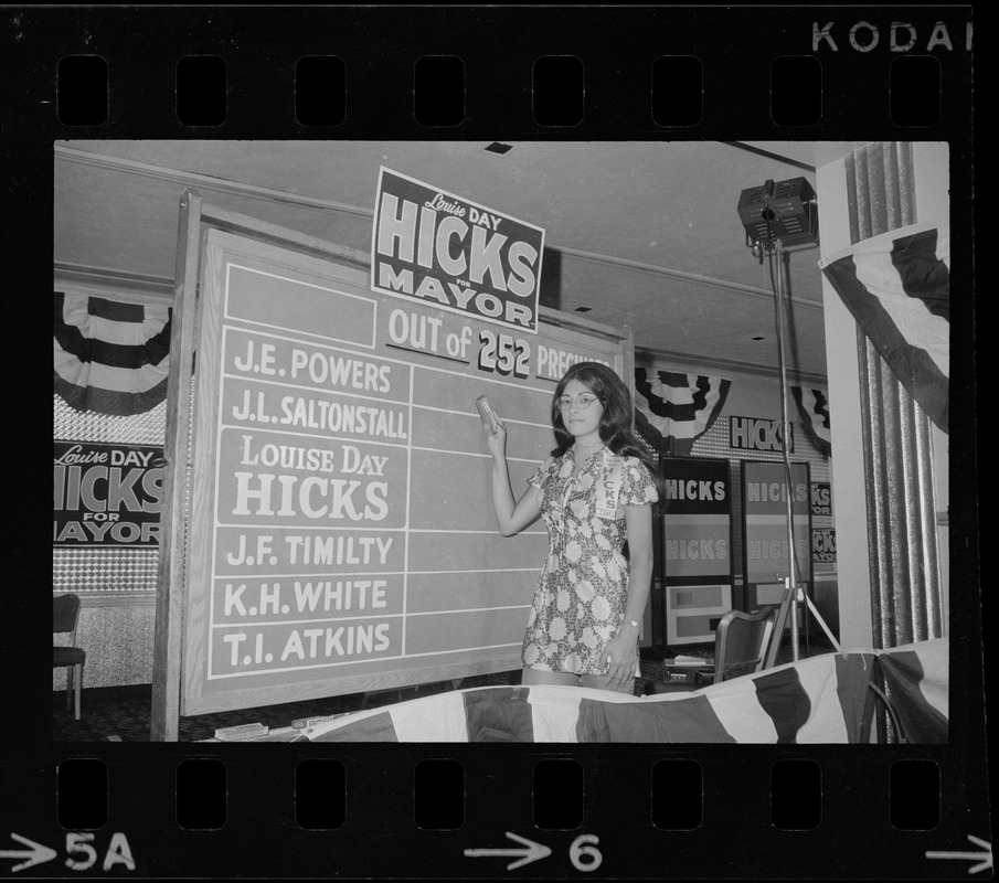 Campaign worker for Louise Day Hicks's primary race for mayor seen standing in front of vote counting board