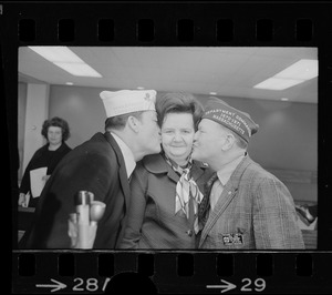 Goodbye kisses from American Legion Cmdr. Leo Barry, left, and VFW Cmdr. Richard Lawler send Rep. Louise Day Hicks off to Vietnam