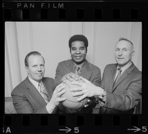 Ron Mitchell (center), new head basketball coach for Boston University, seen with BU Athletic Director, Warren Schmakel (left), and BU Asst. Athletic Director, Charlie Luce (right)