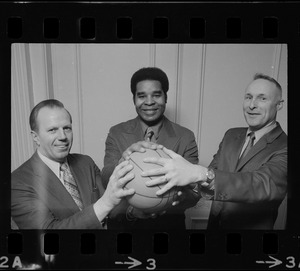 Ron Mitchell (center), new head basketball coach for Boston University, seen with BU Athletic Director, Warren Schmakel (left), and BU Asst. Athletic Director, Charlie Luce (right)