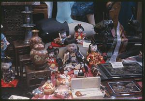 Table with Japanese dolls and other figurines