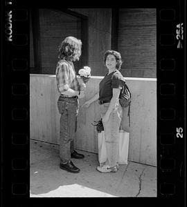 Couple meets with flowers, Boston