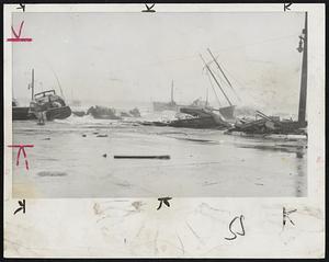 Boats Piled Alongside Bridge -- Hurricane-driven waves forced these boats against a bridge at Fairhaven during the height of the big storm which left millions without power.