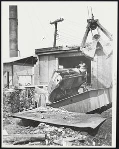 Cap's Auto Parts Lynn. Crane shovel drops Body into Crusher (Robert Arsenault of Lynn, Crusher Operator)
