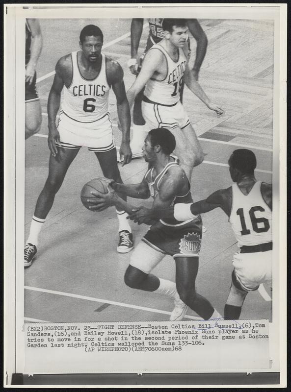 Tight Defense--Boston Celtics Bill Russell, (6), Tom Sanders, (16) and Bailey Howell, (18), isolate Phoenix Suns player as he tries to move in for a shot in the second period of their game at Boston Garden last night. Celtics walloped the Suns 133-106.