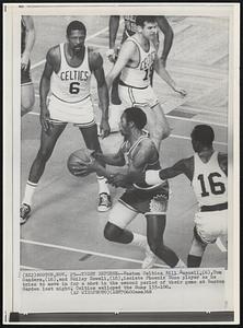 Tight Defense--Boston Celtics Bill Russell, (6), Tom Sanders, (16) and Bailey Howell, (18), isolate Phoenix Suns player as he tries to move in for a shot in the second period of their game at Boston Garden last night. Celtics walloped the Suns 133-106.