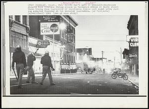 No Man's Land in Berkeley--Hard-core pickets face tear-gas firing police on Telegraph avenue at Haste street three blocks from University of California campus last night after rioting errupted Thursday at the Berkeley institution.