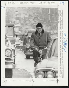 En route to work on this, the 7th day of the transit strike that has crippled New York, a young man has it made as he heads downtown on 2nd. Avenue 1/7.