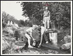 Residents from outlying commands cities draw water from Blue Hills spring.