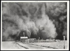 "Black Roller". A "black roller" dust storm swirls down on a ranch yard near Boise City, Okla., in 1935. In the Dust Bowl years from 1934 through 1938 there were 263 such dust storms recorded in Texas and Oklahoma alone. Some areas lost as much as a foot of top soil to the winds.