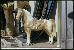 Horse figurine in a window display