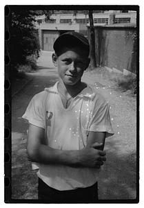 A boy with an medal pinned on his shirt