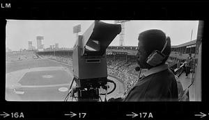 TV cameraman covers baseball game at Fenway Park, Boston