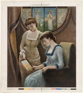 Two women looking at fringed card