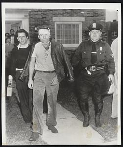 Strike Victim – Richard Scot, 28, Niagara Falls, (head bandaged) is escorted from a doctor’s office in Buffalo, N.Y., after receiving treatment for head and arm injuries he said he suffered when Bell Aircraft strikers clubbed him as he approached the plant in nearby Wheatfield.