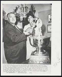 Trophy For Wilma – Wilma Rudolph Ward, track star at Tennessee A&I, receives Babe Didrikson Zaharias Memorial Trophy denoting Woman Athlete of the Year in 1961. Presentation is made by George Zaharias, husband of the great Babe before her death in 1956. Wilma and Babe both starred in Olympics, Wilma in 1960 and Babe in 1932. As Wilma Rudolph, Mrs. Ward was selected as The Associated Press Woman Athlete of the Year in 1960 and 1961.