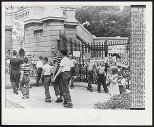 Children Picket--Neighborhood children want to wade in water works park pool and are picketing the locked gates to dramatize their troubles. The park was closed for "security reasons" after the start of the Korean war, because the park is the largest water supply to the City of Detroit. The city council closed the park for fear of sabotage which would cripple the city's supply system. The council has promised to take the matter up of reopening the park.