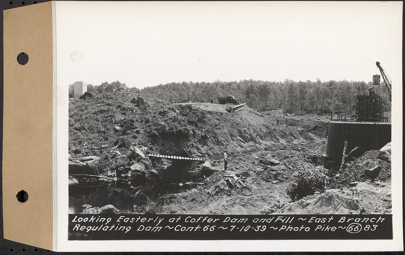 Contract No. 66, Regulating Dams, Middle Branch (New Salem), and East Branch of the Swift River, Hardwick and Petersham (formerly Dana), looking easterly at cofferdam and fill, east branch regulating dam, Hardwick, Mass., Jul. 10, 1939