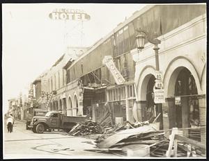 Quake Ruins-Hotel wall in El Centro, Calif., crumbled by earthquake that shook entire Imperial valley. Scores were injured and at least seven persons killed.