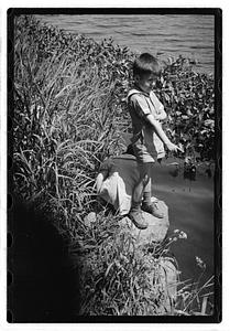 Children by a body of water