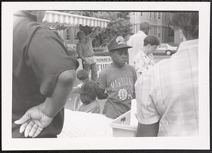 Boy outside at a market