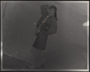 Young woman with hand behind her head