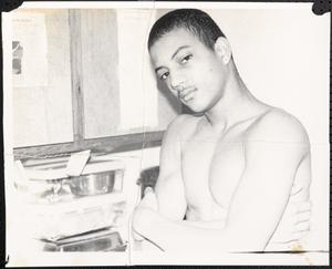 Young man posing with arms crossed