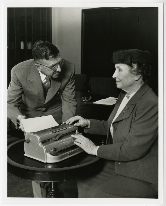 Helen Keller accepting the gift of Perkins Brailler from Edward J. Waterhouse
