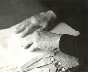 Helen Keller reading braille