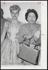 Companion of the Late Errol Flynn, blonde Beverly Aadlund (left) arrives in court in Los Angeles for a hearing that could place her in a juvenile home. She has been held since the accidental shooting of Billy Stanciu, 21, in her apartment. Her mother is charged with aiding in delinquency.