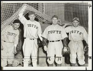 With a likely looking team in the offing, Tufts baseball candidates can hardly wait for the snow to get off the ground. Pushing the netting up at the indoor baseball cage and trying to rush the season at Medford are, left to right, Bill Paglia, TY Burns, Coach Ken Nash Capt. Joe Weeks. Paglia and Burns are pitchers while Capt. Weeks will be behind the bat handling their shoots.
