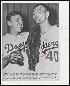 Dodgers Celebrate--Gil Hodges (left), the Los Angeles Dodgers veteran who scored the winning run as the Dodgers beat Milwaukee for the National League pennant today, dumps a bottle of Coke on the head of the young pitcher, Stan Williams, who finished the game for the winners.