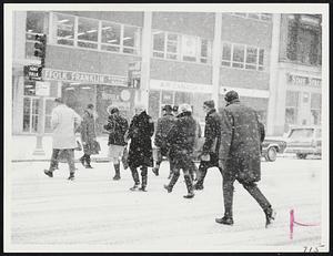 Trying to get to work before 9 AM as snow storm starts in Copley Square